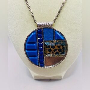 Vintage blue patchwork pendant on a long silver tone rope chain. 30 inches long